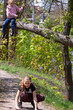 © Nataliia Makarovska - teenage girl jumping from a broken tree to a path in the forest