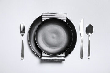 Stylish table setting on white background, top view