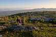 © Cavan Images - Two hikers stand on summit of Mountain looking at view, Appalachians
