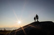 © Cavan Images - Two hikers walk above tree line on Moxie Bald Mountain in Maine.