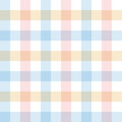 Gingham pattern in blue, pink, yellow, white. Multicolored vichy checked plaid graphic for gift wrapping paper, dress, tablecloth, or other modern spring and summer fashion textile print.