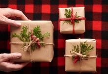 Hands Placing Gift - Rustic Christmas Gifts