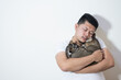 © Igunt - Asian man suffering from depression, he hugs a cute cat to heal his soul