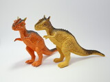 Fototapeta Dinusie - Pair of dinosaurs. Toy dinosaurs for children. Plastic toys.