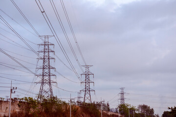 Wall Mural - Electricity pole with dark sky before sunrise, Transmission line of electricity to rural, electricity transmission pylon