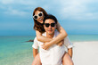 © geargodz - couple piggyback ride on the sea beach at Koh MunNork Island, Rayong, Thailand