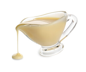 Gravy-boat with sweet condensed milk on white background