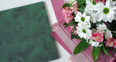 Wall Mural - bouquet of flowers on a white background. top view, copy space