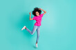 © deagreez - Full size photo of young happy positive smiling cheerful girl jump showing v-sign isolated on turquoise color background