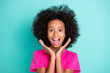 © deagreez - Photo portrait of excited afro american girl screaming with palms near face isolated on vivid cyan colored background