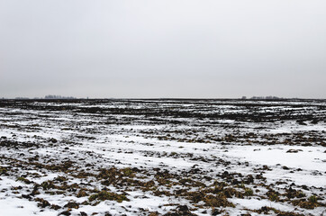 Snow-covered arable land in central Russia in winter