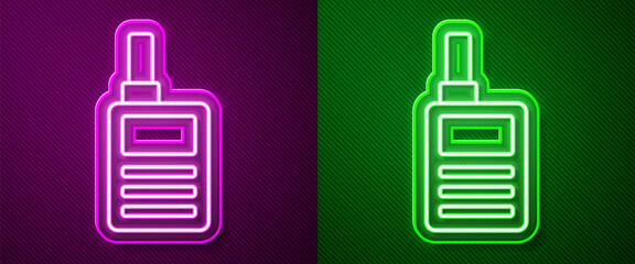 Poster - Glowing neon line Baby Monitor Walkie Talkie icon isolated on purple and green background. Vector.