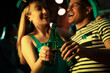 © New Africa - Couple with beer celebrating St Patrick's day in pub, focus on hands