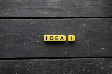 Idea, creative vintage concept. The inscription of their yellow cubes.