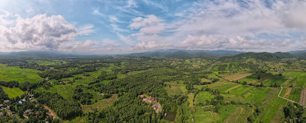 Wall Mural - Aerial view, Beautiful Panorama landscape sunrise over peak Mountain with warm light sunrise Mae Moh Lampang, Thailand