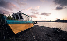 Old Wooden Boat During Low Tide In Castro, Chiloe, Chile