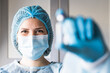 © Cavan Images - Medical doctor or laborant holding tube with nCoV Coronavirus vaccine for 2019-nCoV virus.