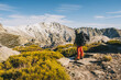 © Cavan Images - Young man looking at his objective summit during hike stop, Gredos, Avila, Spain