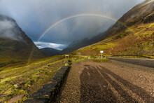 Mountains In Scotland With A Rainbow