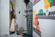 © Cavan Images - Little girl in tiara looking up at dad in domestic kids bedroom