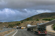 Several special transport trucks on the road transporting wind turbine blades.