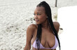 Black bikini girl at the beach with nice body 