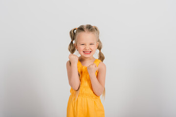 Portrait of happy smiling child girl isolated on white background