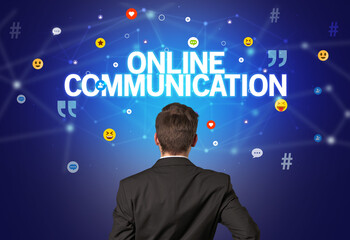 rear view of a businessman with online communication inscription, social networking concept