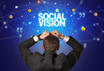 rear view of a businessman with social vision inscription, social networking concept