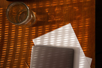 Workflow - Laptop and Paper with Glass on Amber Background - Textured 