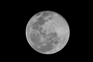 Wall Mural - Full moon stack dark night sky. The full moon is lunar phase when It appears fully illuminated from Earth's perspective. It occurs when Earth is located between Sun and Moon appears as a circular disk