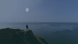 © realstock1 - The hiker standing on the mountain against night sea view