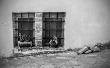 Windows in an old residential building in the historic medieval village of Scansano, Grosseto Province, Tuscany, Italy
