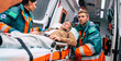 © My Ocean studio - Serious and professional team of doctors in the ambulance moving on a patient into the hospital during an emergency situation.