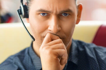 Close-up portrait of a human with a headset.