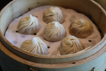 Closeup Shot Of Xiao Long Bao Steamed Soup Dumplings In A Bamboo Steamer Basket