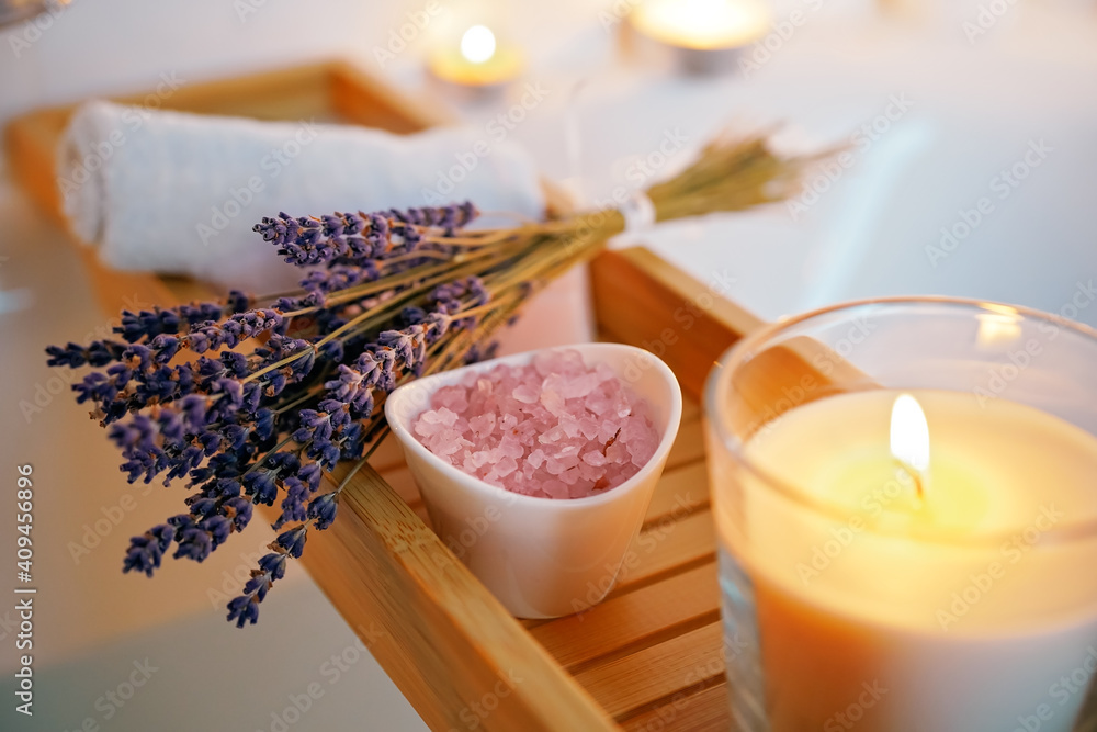 Spiritual aura cleansing ritual bath for full moon ritual. Candles, aroma salt and lavender on tub table, close up - obrazy, fototapety, plakaty 