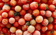 Frozen cherry tomatoes background. Frozen vegetables.