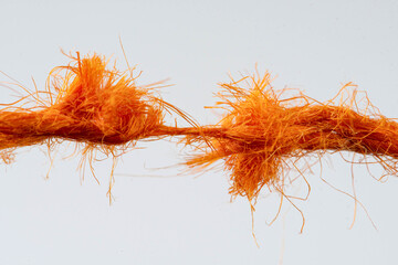 tear test of a red thread closeup