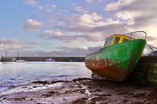 Old Rusted Boat Out Of The Water At Barna Pier