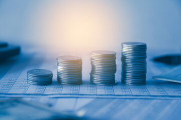 Stack of money coin on accounting sheet with selective focus, Business and financial concept. 