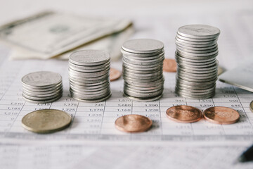 Stack of money coin on accounting sheet with selective focus, Business and financial concept. 