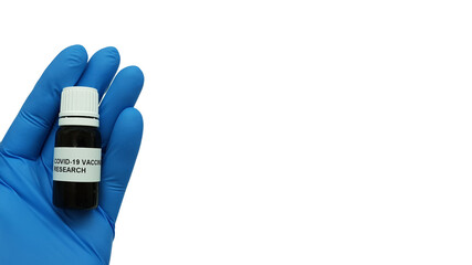 Wall Mural - Laboratory assistant hand holding a vial of Covid-19 vaccine on a white background