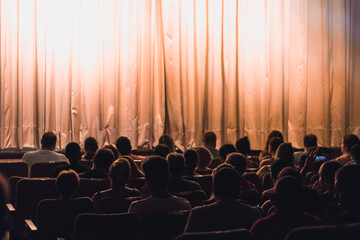 People In The Auditorium Looking At The Stage