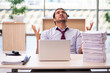 © Elnur - Young male employee unhappy with excessive work in the office