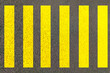 Zebra crossing made of stripes white and black lines painted on road for pedestrians crossing on busy traffic highways