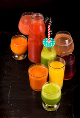 Sticker - fruit and vegetable juices on a dark background