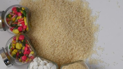 Sticker - View of white rice isolated over white background with glass bottles filled with tablets