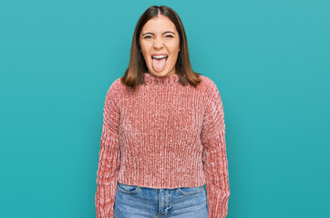 Sticker - Young beautiful woman wearing casual clothes sticking tongue out happy with funny expression. emotion concept.