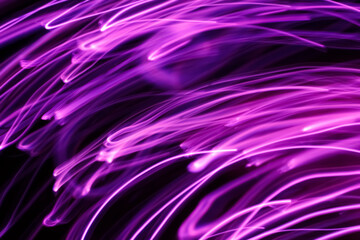 Wall Mural - long exposure pink lights abstract texture background. pink lights drawing patterns on black backgro